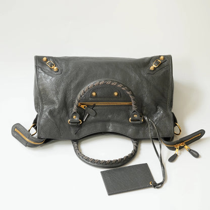 Grey Balenciaga Classic City bag top view with gold hardware, top zip closure, wide opening for daily use