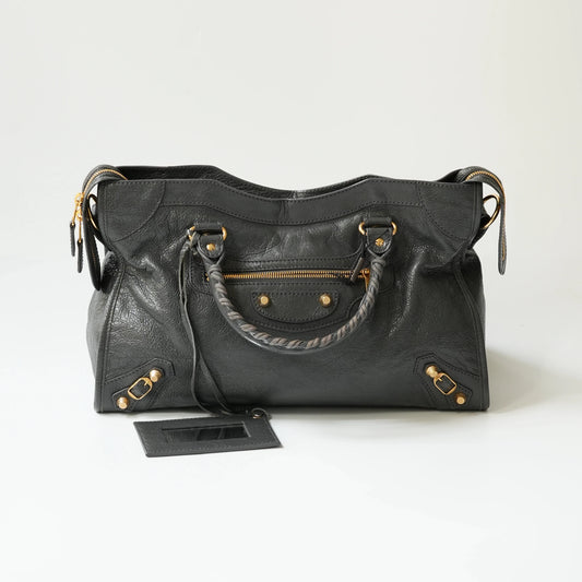 Grey Balenciaga Classic City bag front view with gold hardware, iconic moto design with braided handle and rivet details