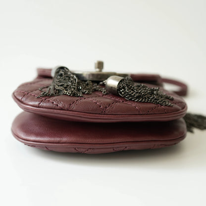 Bottom view of Chanel mini crossbody bag with neat base stitching and structured shape