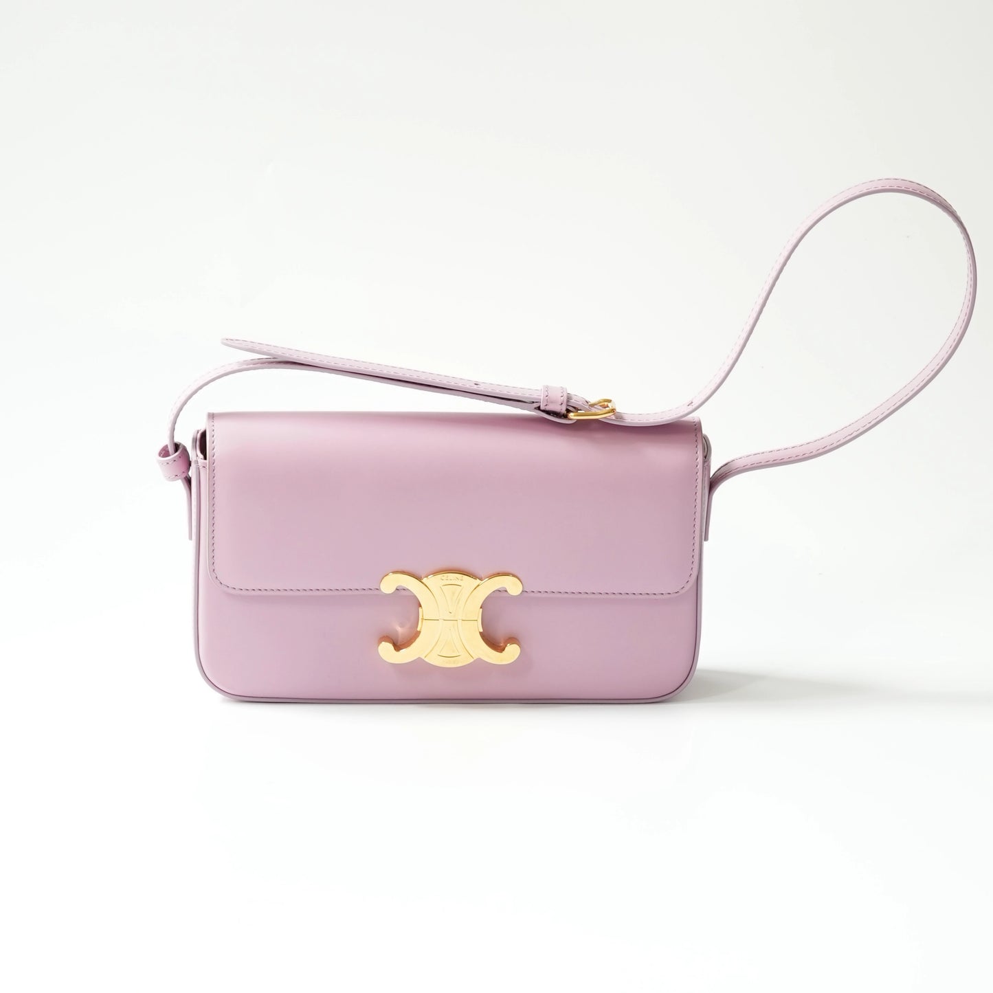 Front view of lavender shiny calfskin Triomphe bag with gold Triomphe clasp and adjustable matching leather strap.