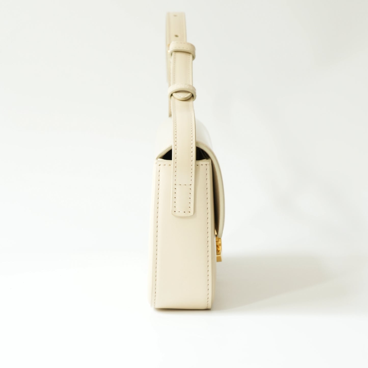 Side view of Celine Triomphe shoulder bag showing thickness and strap