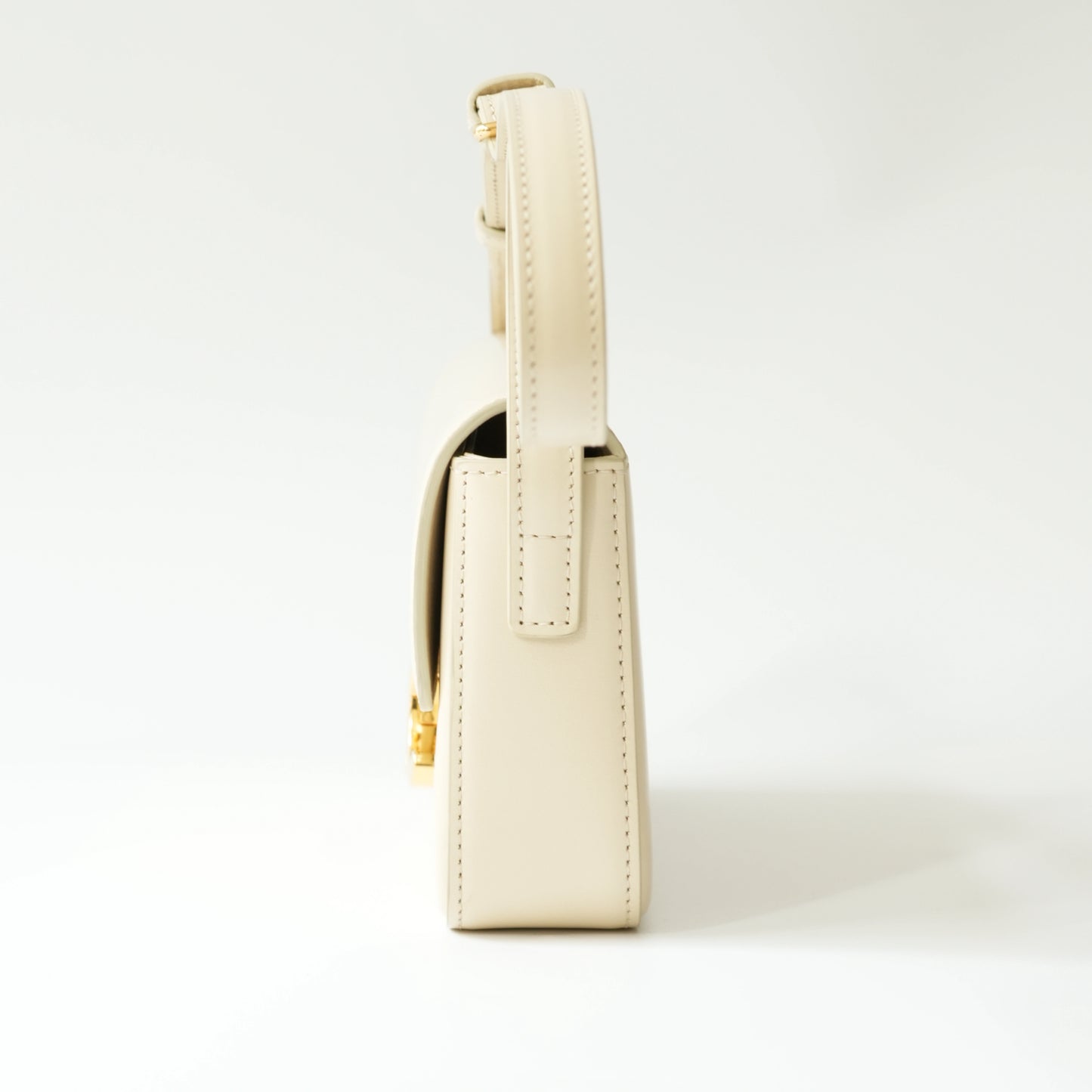 Side view of Celine Triomphe shoulder bag showing thickness and strap
