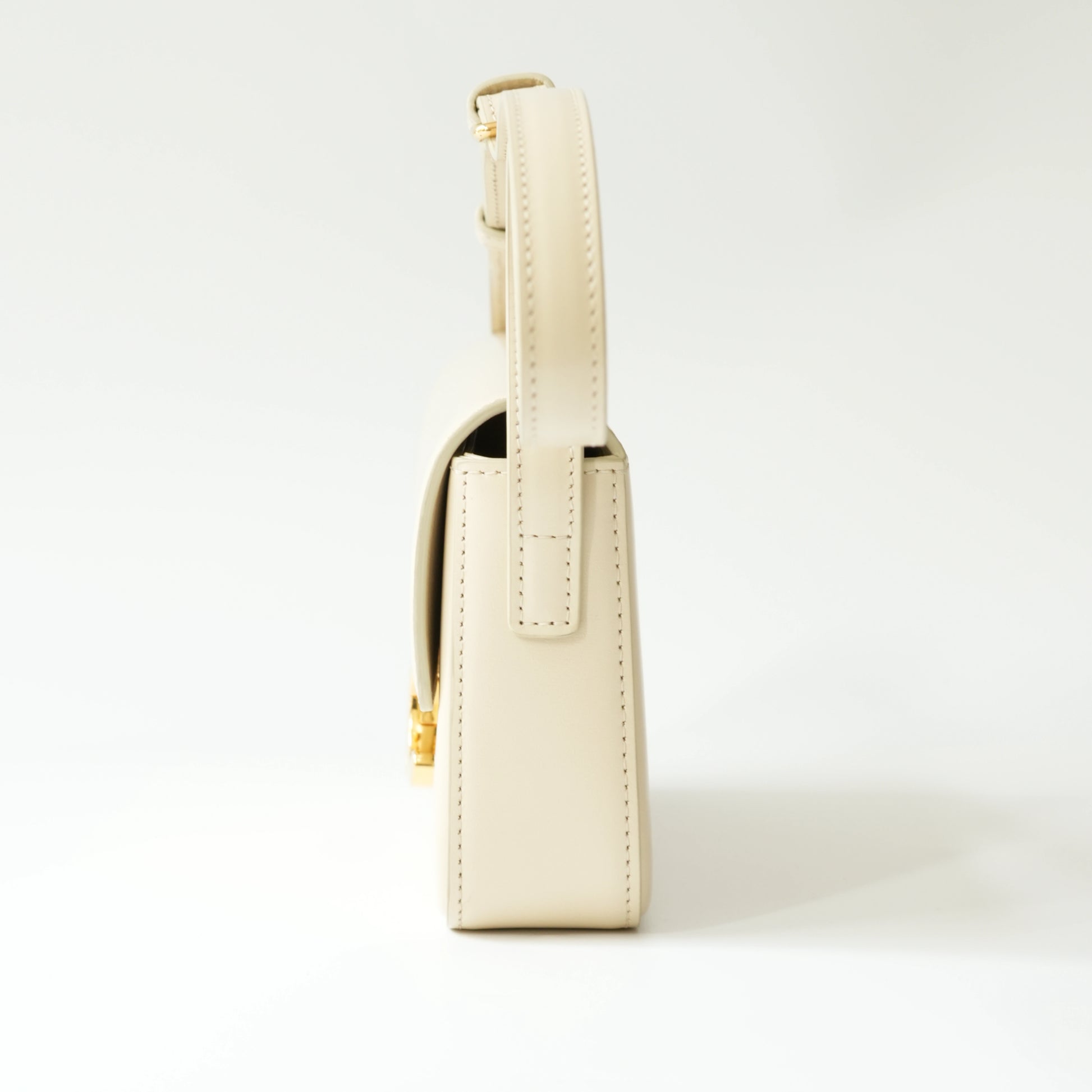 Side view of Celine Triomphe shoulder bag showing thickness and strap