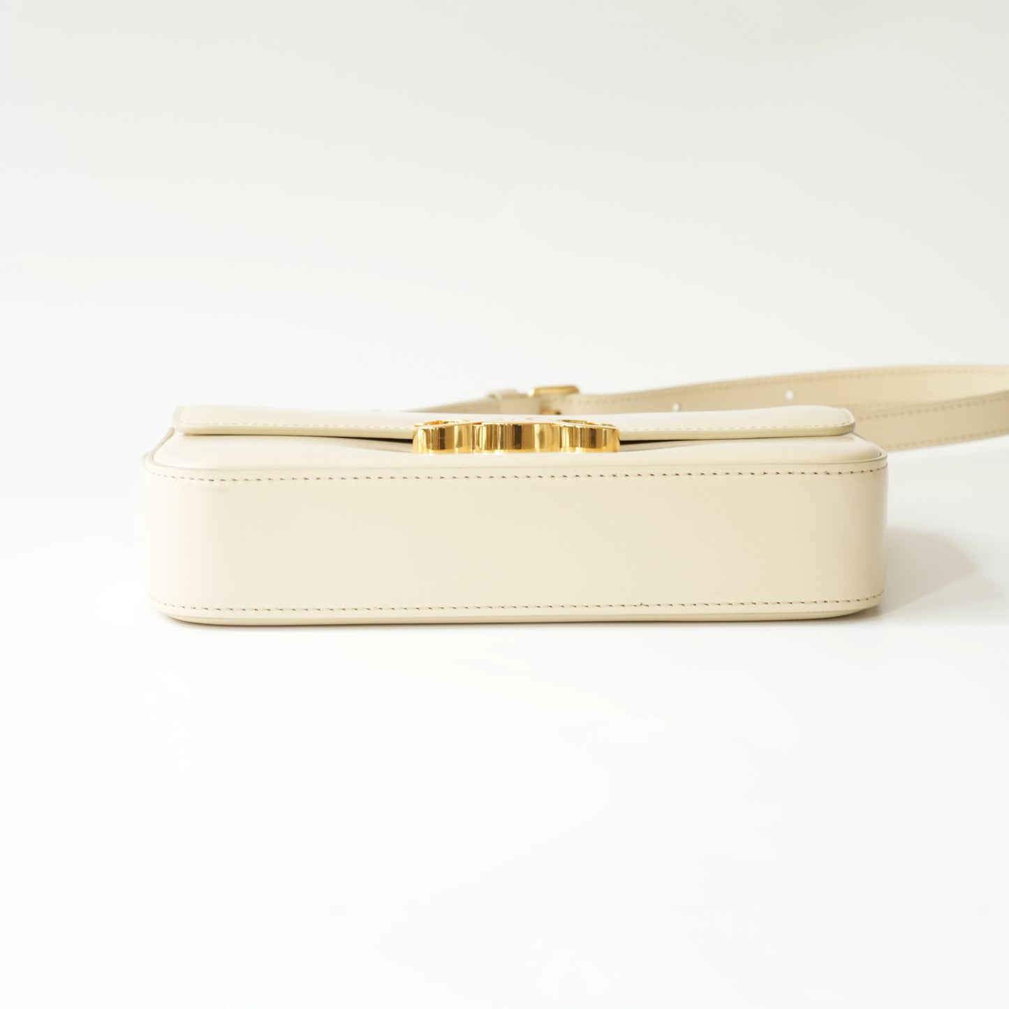 Bottom view of Celine Triomphe shoulder bag with flat structured base