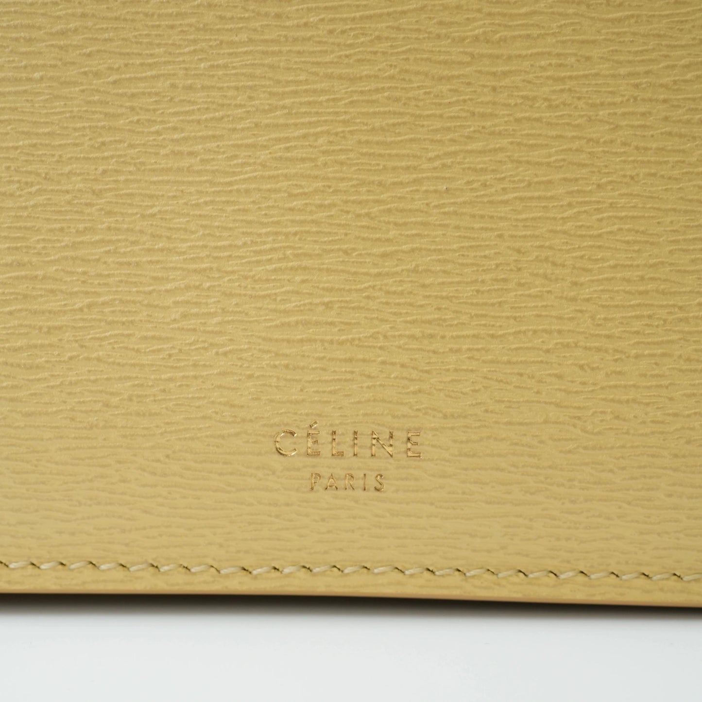 Detail view of Celine clasp bag precision leather stitching and high-shine metal hardware