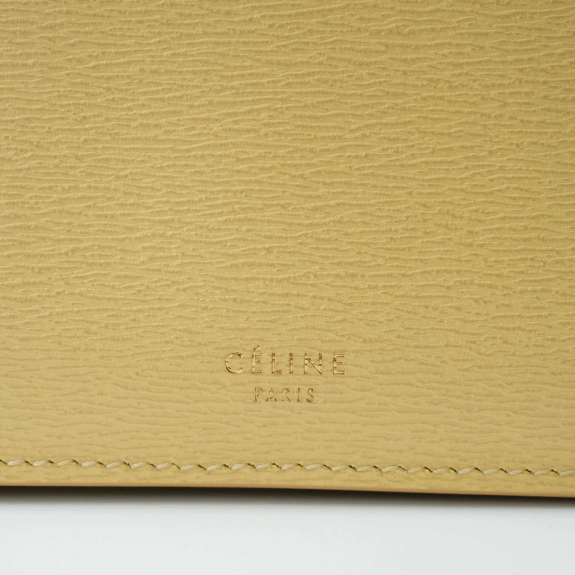 Detail view of Celine clasp bag precision leather stitching and high-shine metal hardware