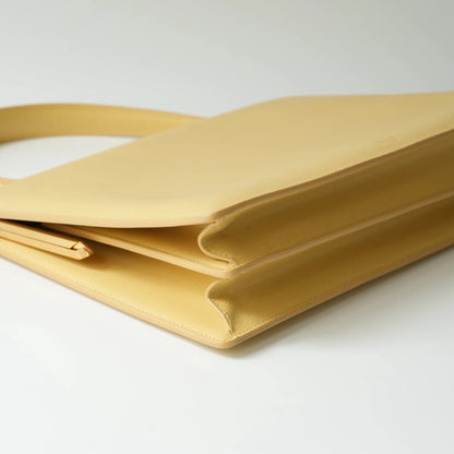 Detail view of Celine clasp bag precision leather stitching and high-shine metal hardware