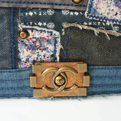 Detail view of aged gold Boy clasp and patchwork denim fabric details