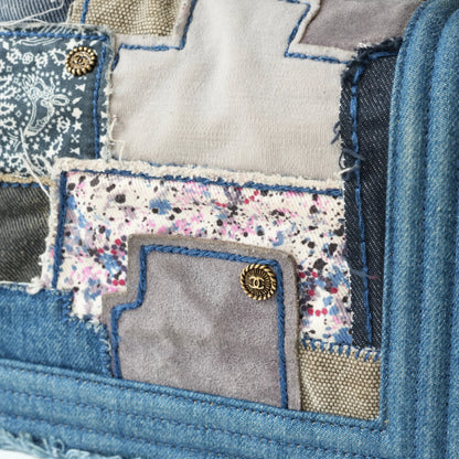 Detail view of aged gold Boy clasp and patchwork denim fabric details