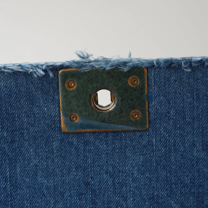 Detail view of aged gold Boy clasp and patchwork denim fabric details