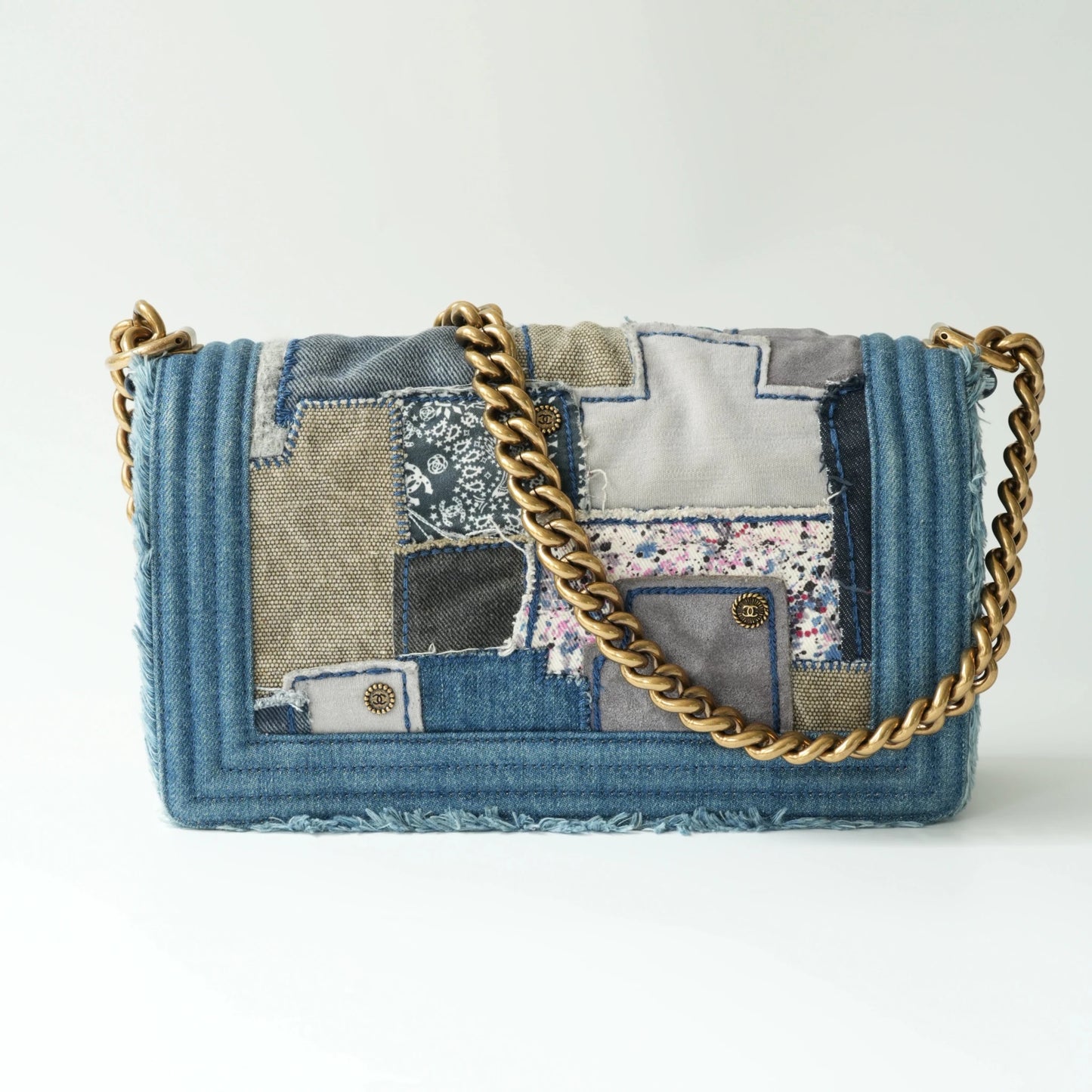 Back view of Chanel Boy bag in patchwork denim with leather trim