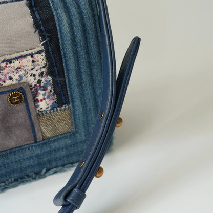 Detail view of aged gold Boy clasp and patchwork denim fabric details