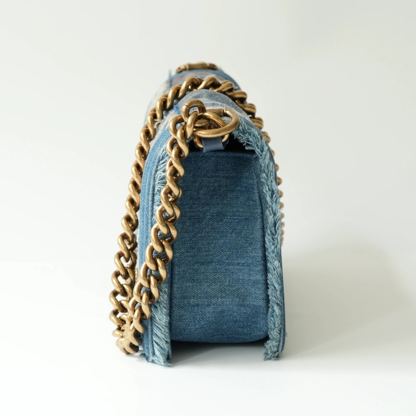 Side view of Chanel Boy bag showing thickness and thick chain strap
