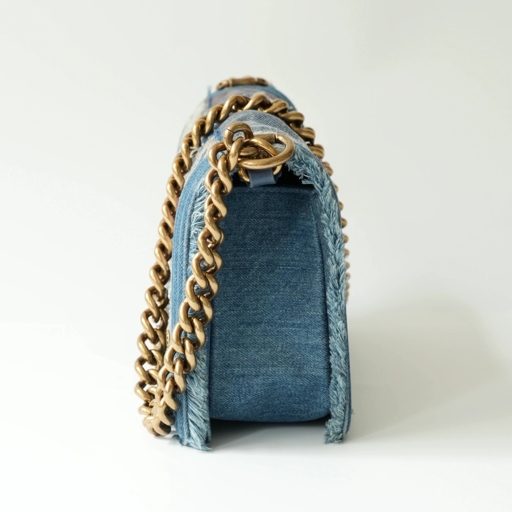 Side view of Chanel Boy bag showing thickness and thick chain strap