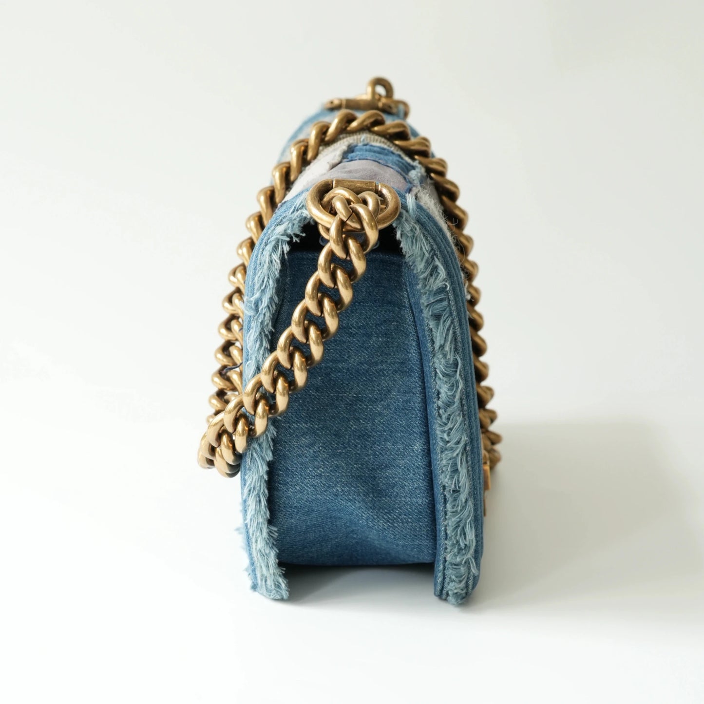 Side view of Chanel Boy bag showing thickness and thick chain strap