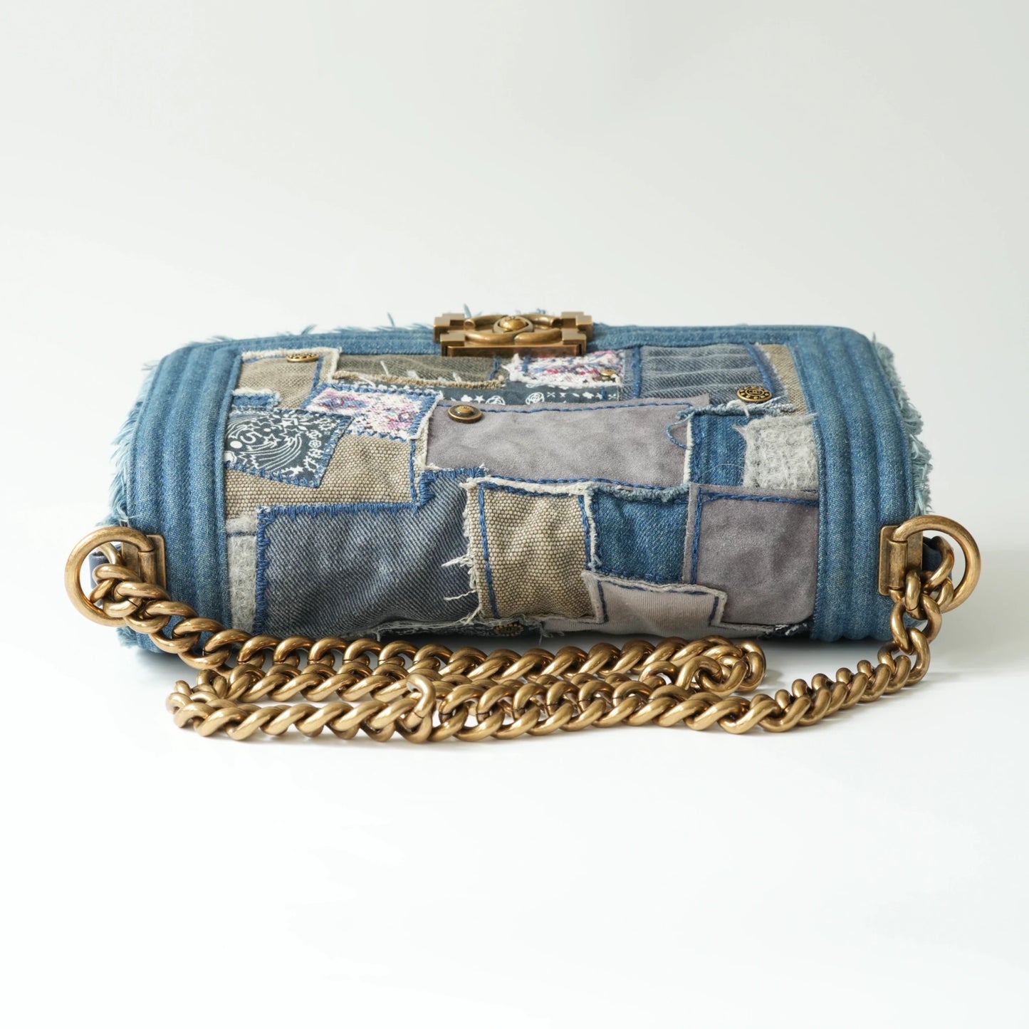 Top view of Chanel Boy bag with aged gold chain and leather shoulder pad