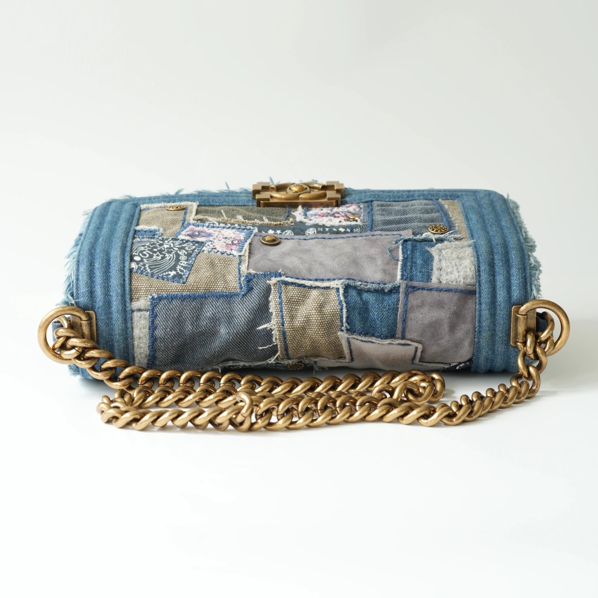 Top view of Chanel Boy bag with aged gold chain and leather shoulder pad