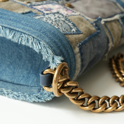 Detail view of aged gold Boy clasp and patchwork denim fabric details