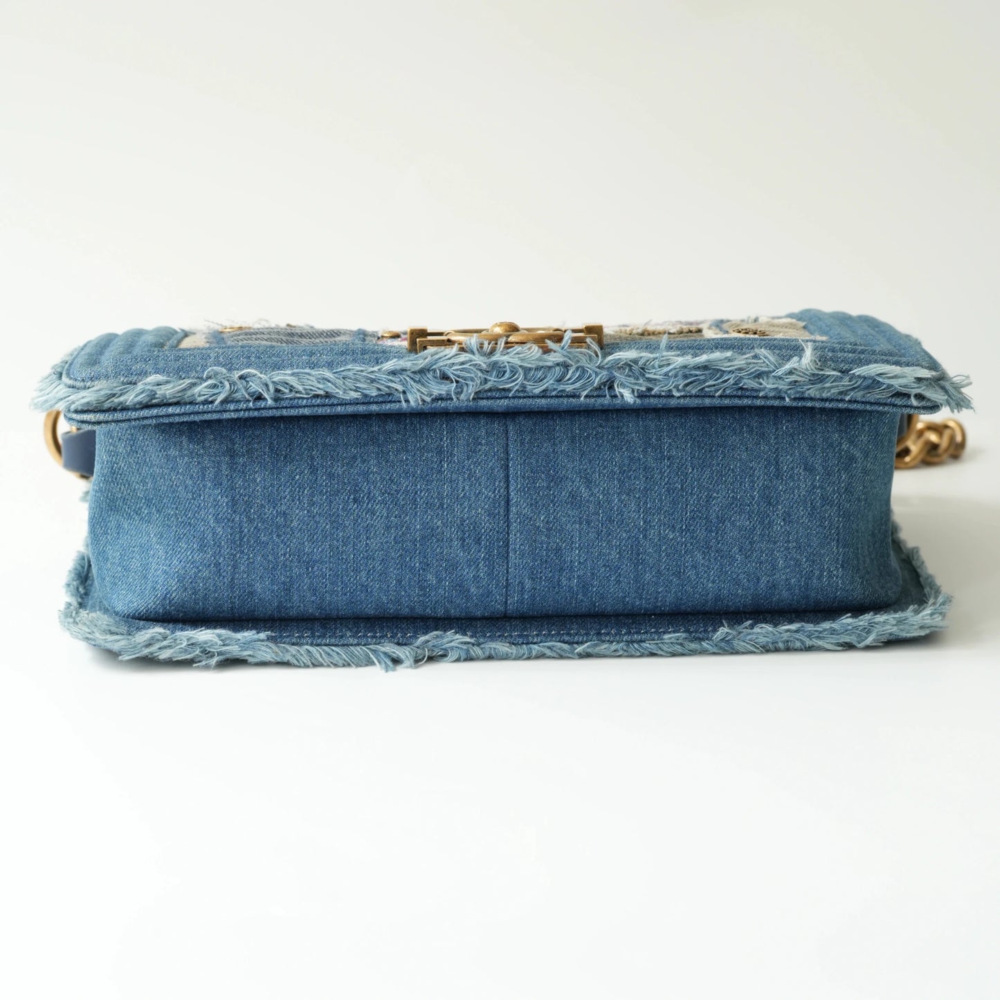 Bottom view of Chanel Boy bag with structured denim base
