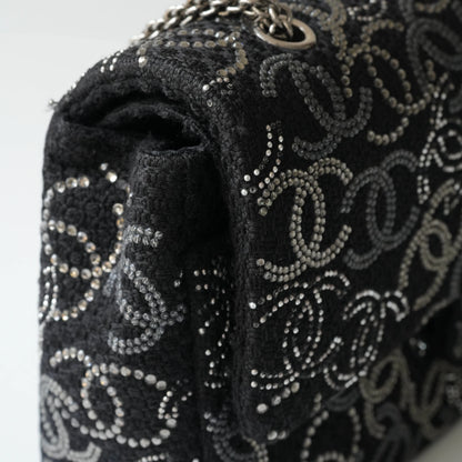Detail view of silver interlocking CC turnlock and crystal embellishments
