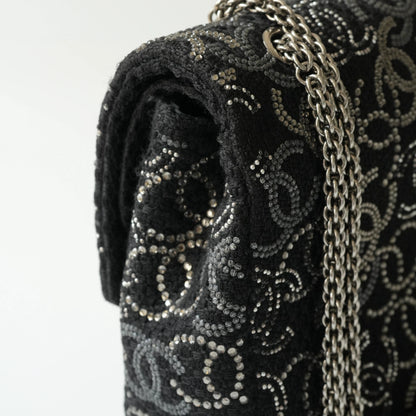 Detail view of silver interlocking CC turnlock and crystal embellishments