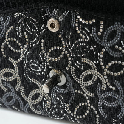 Detail view of silver interlocking CC turnlock and crystal embellishments