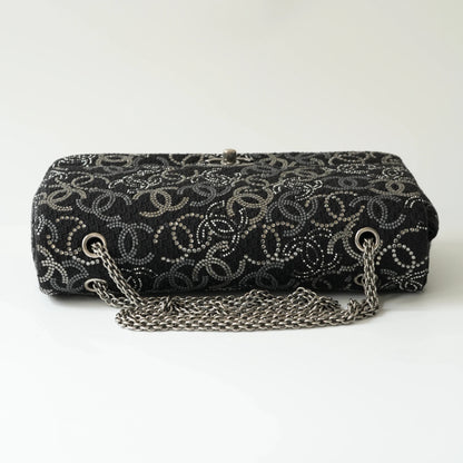 Top view of Chanel classic flap bag with silver-toned chain strap