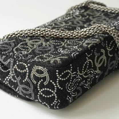 Detail view of silver interlocking CC turnlock and crystal embellishments