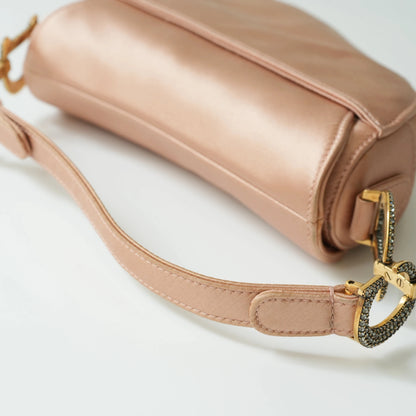 Detail view of crystal-embellished D stirrup charm and CD hardware