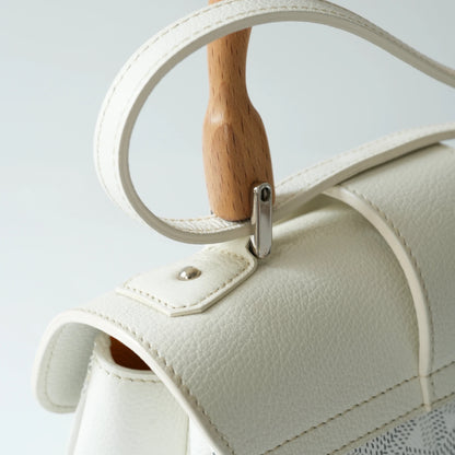 Detail view of beech wood handle and Goyardine chevron monogram pattern