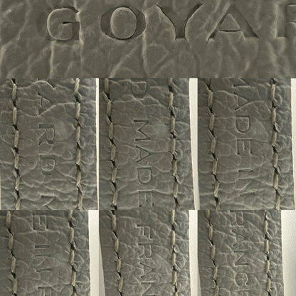 Detail view of beech wood handle and Goyardine chevron monogram pattern