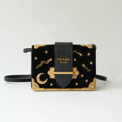 Front view of Prada Astrology Cahier bag in black velvet with gold moon and stars