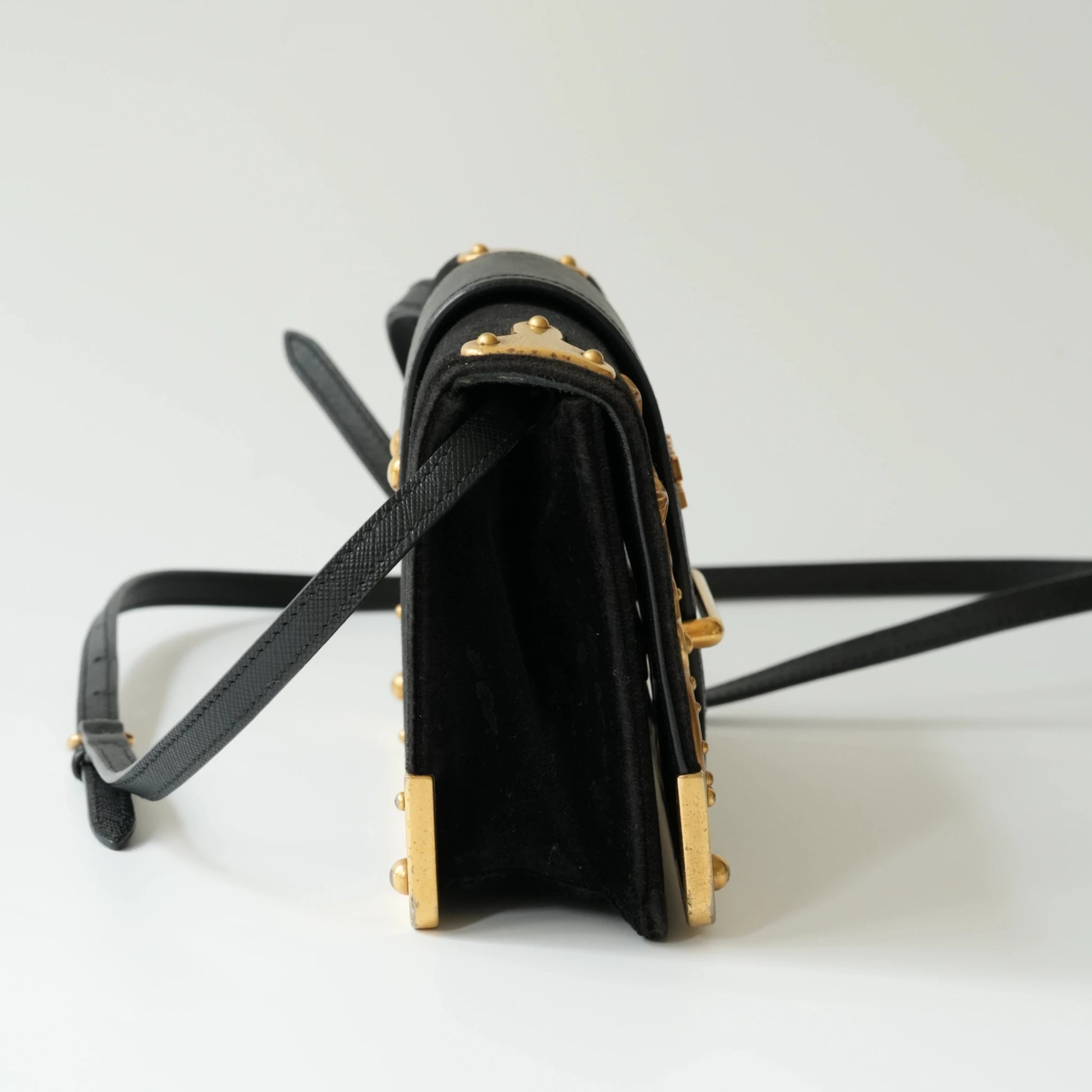 Side view of Prada Cahier bag showing structured box silhouette