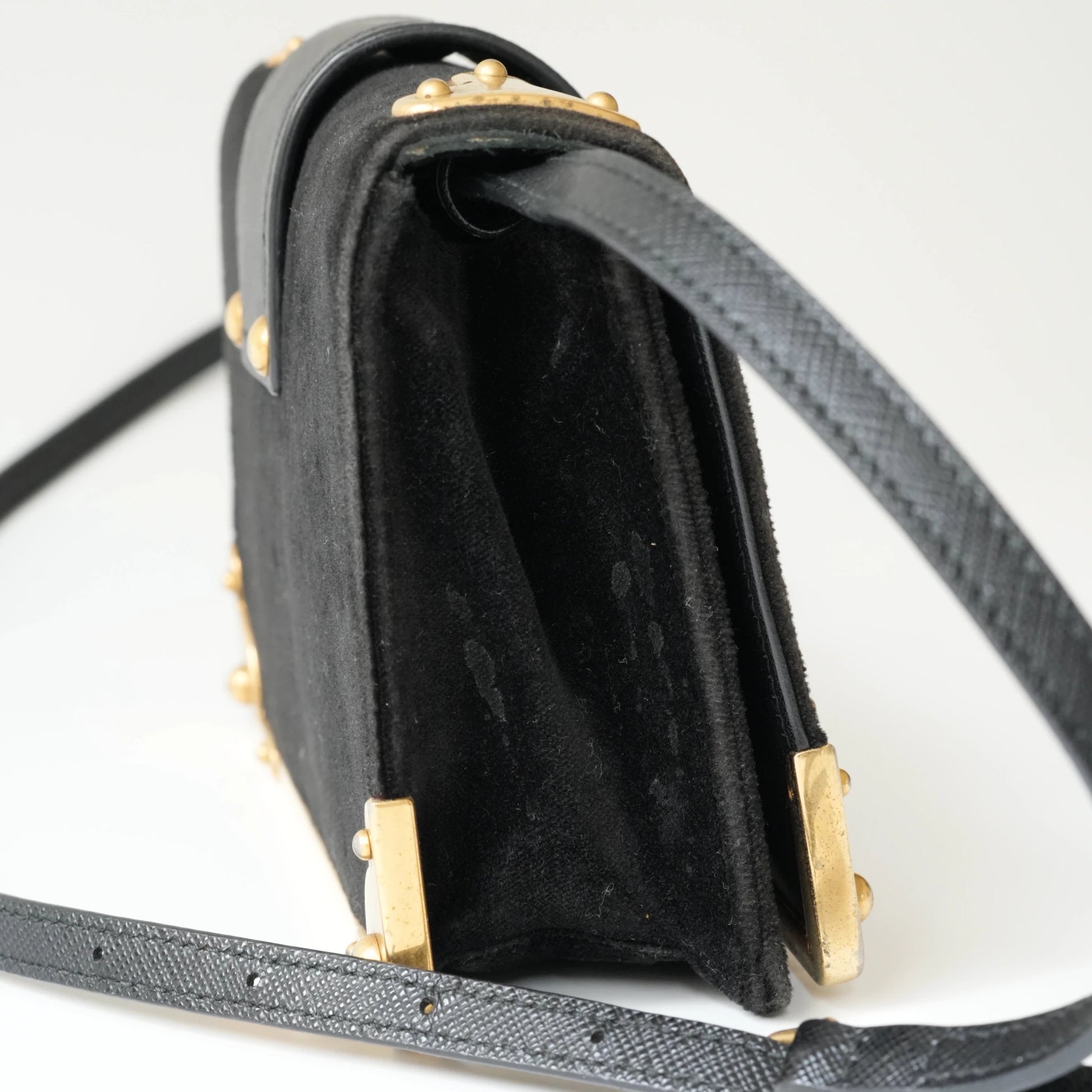 Side view of Prada Cahier bag showing structured box silhouette