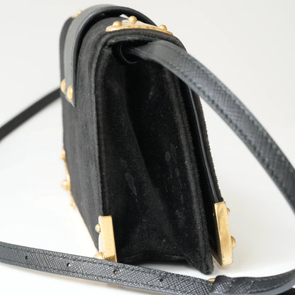 Side view of Prada Cahier bag showing structured box silhouette
