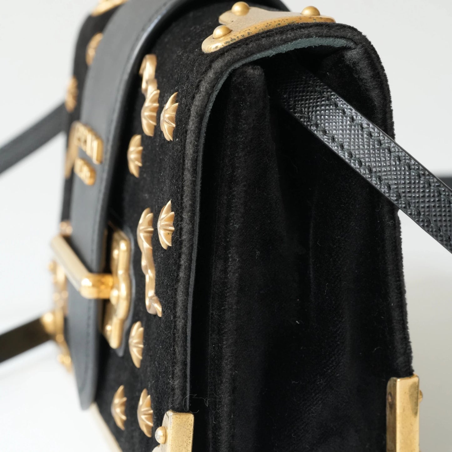 Side view of Prada Cahier bag showing structured box silhouette