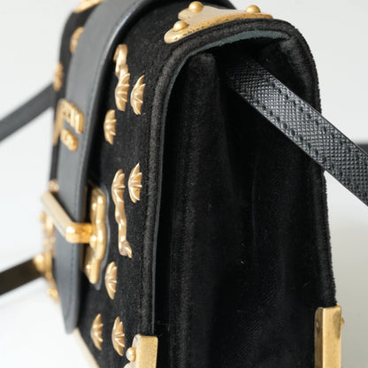 Side view of Prada Cahier bag showing structured box silhouette